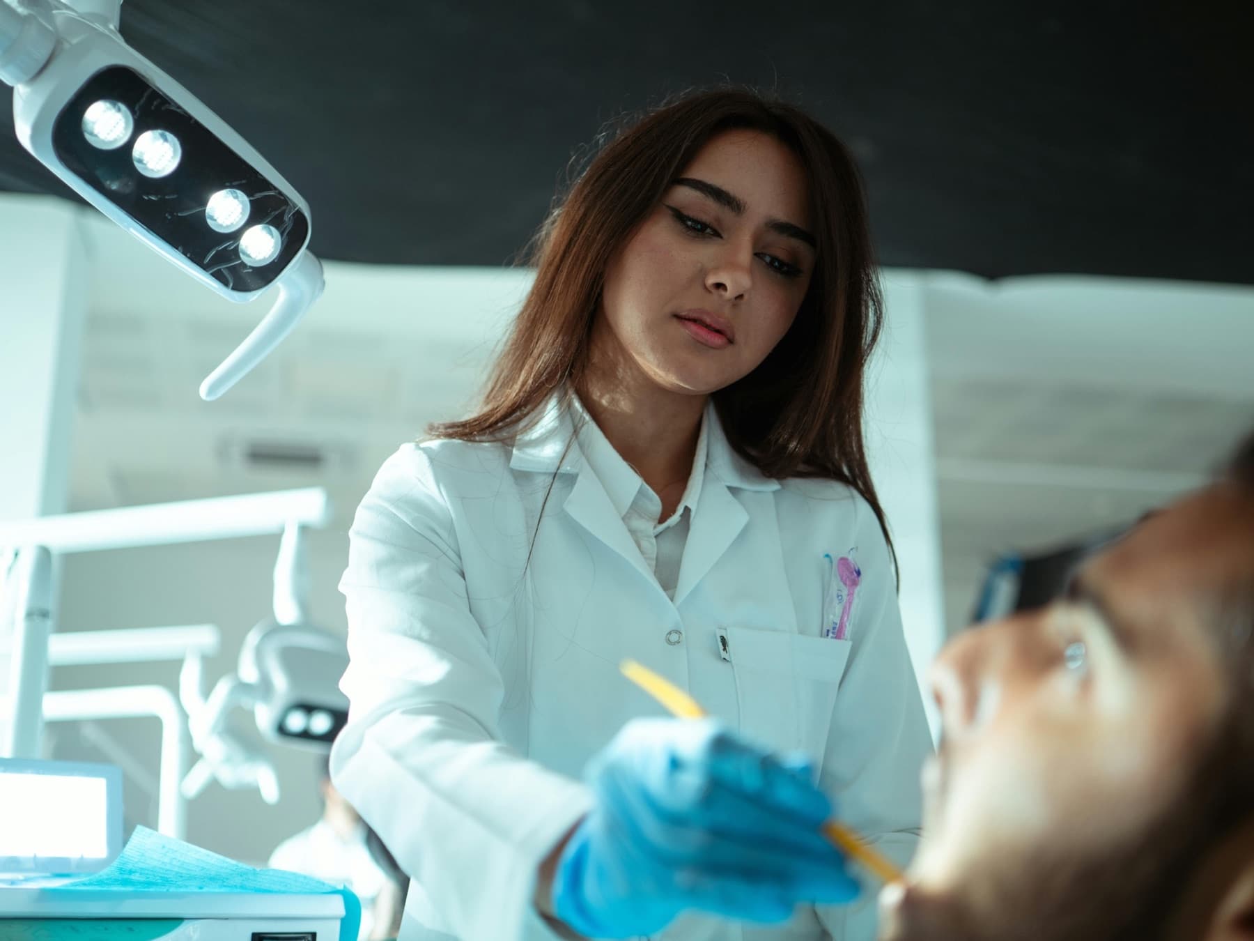 A dentist treating a patient in a modern dental clinic.